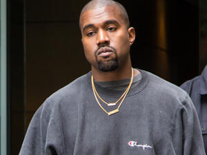 Kanye West cut a call short to wife Kim on Tuesday to engage in a heartfelt chat with the paparazzi. (Source: Liam Goodner / Shutterstock )