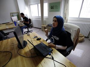 Palestinians work at the office of Red Crow, a startup that monitors security developments and sends real-time alerts to clients. (AFP/Abbas Momani) Palestinians work at the office of Red Crow, a startup that monitors security developments and sends real-time alerts to clients. (AFP/Abbas Momani)