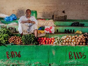 A man sells vegetables in Khartoum, Sudan on April 18, 2016.  (Photo courtesy Ahmad Aladdin at portraitat.tumblr.com)