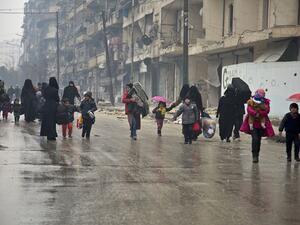 Picking up the pieces: Families in Aleppo roam the streets in search of better amenities (AFP/File Photo)	