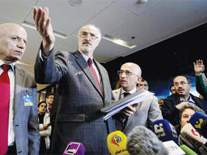 Syrian ambassador to UN and head of the government delegation Bashar Al-Jaafari (center) gestures as he holds a press conference during the Syria peace talks. (AFP/File)