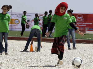 Syrian children play a football match in Jordan's Zaatari refugee camp on July 6, 2013.  (AFP/Khalil Mazraawi)