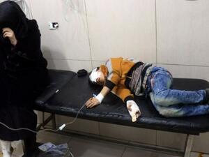 Wounded Syrians are seen on a table in a crowded makeshift hospital in eastern Aleppo. (AFP/File)