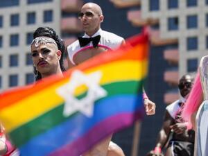 Performers dance on a stage during 2014's Tel Aviv Pride festival, which attracted nearly 200,000 party-goers.  (AFP/Jack Guez)