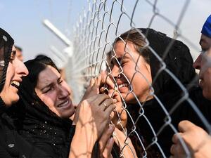 Displaced Iraqis reunite with relatives on October 26, 2016 as battle for Mosul forces thousands to flee their homes. (AFP/ Bulent Kilic) Displaced Iraqis reunite with relatives on October 26, 2016 as battle for Mosul forces thousands to flee their homes. (AFP/ Bulent Kilic)