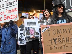 Tommy Robinson supporters protesting (AFP)