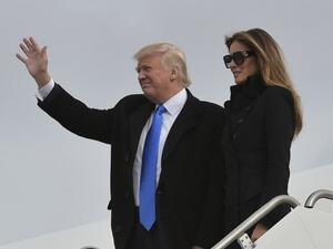 US President Donald Trump and his wife Melania step off a plane upon arrival at Andrews Air Force Base in Maryland on January 19, 2017. (AFP/ Mandel Ngan) US President Donald Trump and his wife Melania step off a plane upon arrival at Andrews Air Force Base in Maryland on January 19, 2017. (AFP/ Mandel Ngan)