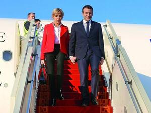 French President Emmanuel Macron and his wife Brigitte Macron descend from an airplane upon their arrival at Tunis-Carthage International Airport on January 31, 2018. (Zoubeir Souissi/ AFP) French President Emmanuel Macron and his wife Brigitte Macron descend from an airplane upon their arrival at Tunis-Carthage International Airport on January 31, 2018. (Zoubeir Souissi/ AFP)