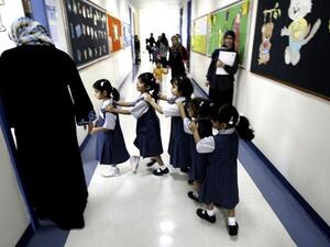 Students line up as they enter their classroom on the first day of the academic year for public schools in Dubai on September 27, 2009. (Karim Sahib/ AFP) Students line up as they enter their classroom on the first day of the academic year for public schools in Dubai on September 27, 2009. (Karim Sahib/ AFP)