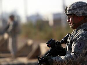 A US soldier stands guard at an American military base in Iraq. (AFP/File)
