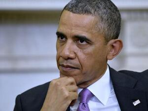 US President Barack Obama watches as Emir of Qatar Sheikh Hamad bin Khalifa al-Thani speaks to the media (Jewel Samad/ AFP)
