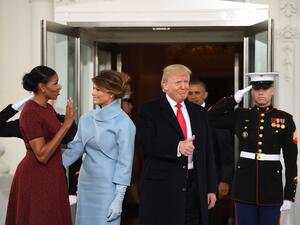 President-elect Donald Trump gives a thumbs up as he and his wife Melania are greeted by US President Barack Obama and First Lady Michelle Obama as they arrive at the White House in Washington, DC January 20, 2017. (AFP/Jim Watson)