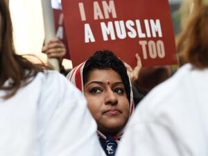 Protesters march in New York's Times Square in solidarity with American Muslims and against the travel ban ordered by US President Donald Trump on February 19, 2017. (AFP/Timothy A. Clary)