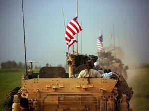 US flag still seen, despite Syria pull-out order (AFP/file photo)