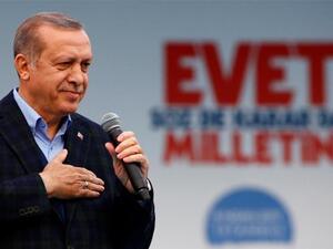 Turkish President Tayyip Erdogan (C) exits a polling booth prior to cast his ballot at a polling station during the municipal elections in Istanbu (AFP)