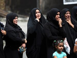 Iraqi women in mourning on July 4, 2016, outside the site of a deadly suicide bombing in Baghdad. (AFP/Ahmad Al-Rubaye)