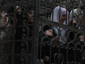 Reports say dozens of cages carrying Alawite army officers and their wives were seen in Eastern Ghouta. (Twitter)