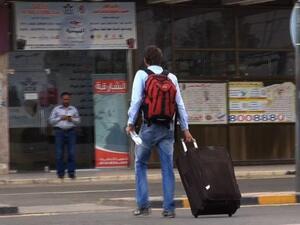 YEMEN, SANAA : An image grab taken from an AFPTV video shows people heading to Sanaa International Airport as they prepare to leave Yemen on August 6, 2013. The United States ordered Americans to leave Yemen "immediately" amid a worldwide alert linked to electronic intercepts from Al-Qaeda leader Ayman al-Zawahiri. AFP PHOTO/AFPTV