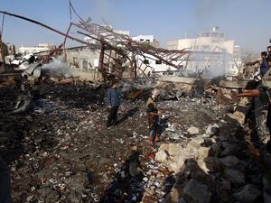Yemenis inspect the damage at a sewing workshop that was hit by a Saudi-led coalition air strike in the capital Sanaa, on February 14, 2016. (AFP/Mohammed Huwais)