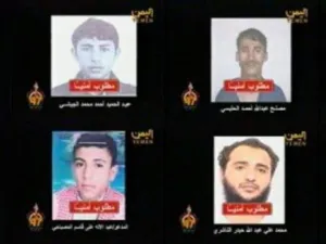 صور المطلوبين الثمانية في لقطة عن التلفزيون اليمن
