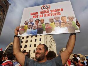 A demonstrator in Beirut participates in Lebanon's "You Stink" protests against government corruption and inefficiency.  Widespread protests grew last month after popular frustration with government inaction on Lebanon's garbage crisis.  (AFP/File)