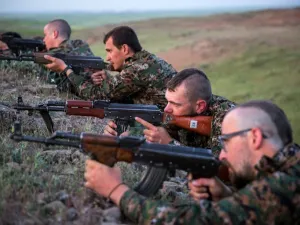 Foreign fighters who joined the Kurdish People's Protection Units (YPG) to fight in their ranks against jihadists and Islamist rebels in northeastern Syria take part in a training session on April 29, 2015 in the south-west Syrian region of Ras al-Ain, close to the Turkish border. (AFP/Uygar Onder Simsek)