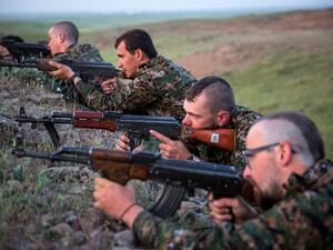 Foreign fighters with the YPG train with long-barreled firearms. (AFP/File)