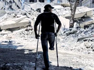 Near a building that was destroyed following air strike in Syria's eastern Ghouta (AFP/File Photo)