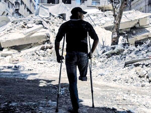 Near a building that was destroyed following air strike in Syria's eastern Ghouta (AFP/File Photo)