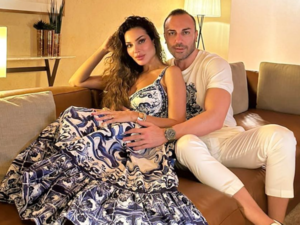 Nadine Njeim on her fiancé's back in a bikini