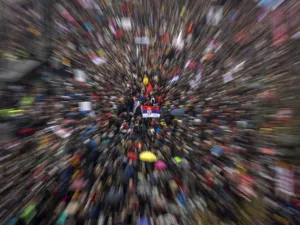 Thousands of people from all over Serbia gathering in front of the National Assembly building in central Belgrade to protest against Serbian President and to demand free media and fair elections (AFP)