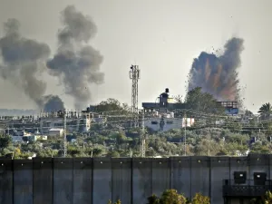 A picture taken from the southern Israeli village of Netiv Haasara shows an explosion and smoke fumes caused by an Israeli airstike across the border in the Gaza Strip (AFP)