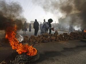 Sudanese protesters close Street 60 with burning tyres and pavers as military forces tried to disperse a sit-in outside Khartoum's army headquarters  (AFP)