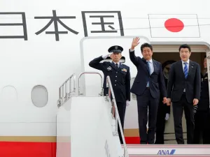 Japan's Prime Minister Shinzo Abe (C) waves to well-wishers upon his departure at Tokyo's Haneda Airport on June 12, 2019. Abe left for a two-day visit to Iran.  JIJI PRESS / AFP
