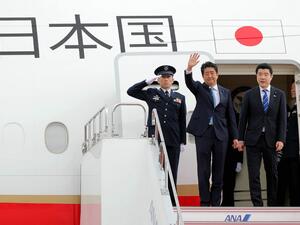 Japan's Prime Minister Shinzo Abe (C) waves to well-wishers upon his departure at Tokyo's Haneda Airport on June 12, 2019. Abe left for a two-day visit to Iran.  JIJI PRESS / AFP