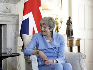British Prime Minister Theresa May speaks with Afghanistan's President Ashraf Ghani at the start of their meeting inside 10 Downing Street in London on June 17, 2019.  Matt Dunham / POOL / AFP