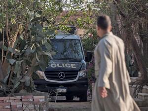 An Egyptian police Vehicle is parked inside a cemetery after the former Egyptian President Mohamed Morsi was buried in Cairo on June 18, 2019.  Khaled DESOUKI / AFP