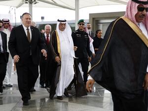 US Secretary of State Mike Pompeo (L) is welcomed by Saudi Foreign Minister Ibrahim Abdulaziz Al-Assaf (C) upon his arrival in the Saudi Red Sea city of Jeddah  (AFP)