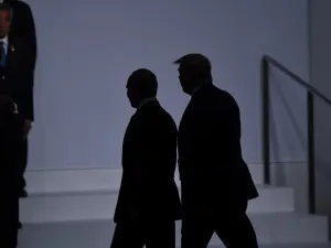 US President Donald Trump (R) walks with Russia's President Vladimir Putin before taking a family photo at the G20 Summit in Osaka on June 28, 2019.  Brendan Smialowski / AFP