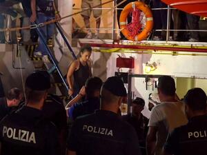Sea-Watch 3 charity ship's German captain Carola Rackete being arrested by Italian police, in the Italian port of Lampedusa, Sicily (AFP)