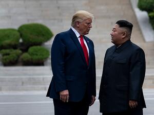 US President Donald Trump and North Korea's leader Kim Jong-un stand on North Korean soil while walking to South Korea in the Demilitarized Zone(DMZ) on June 30, 2019, in Panmunjom, Korea.  Brendan Smialowski / AFP