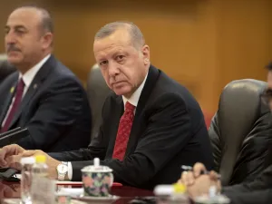 Turkish President Recep Tayyip Erdogan (C) sits during a meeting with Chinese President Xi Jinping at the Great Hall of the People in Beijing on July 2, 2019.  Mark Schiefelbein / POOL / AFP
