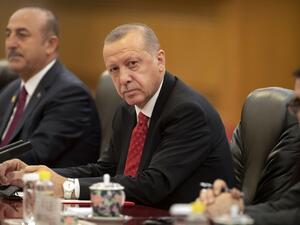 Turkish President Recep Tayyip Erdogan (C) sits during a meeting with Chinese President Xi Jinping at the Great Hall of the People in Beijing on July 2, 2019.  Mark Schiefelbein / POOL / AFP