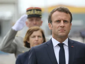 French President Emmanuel Macron takes part in a military ceremony before the official launch of the new French nuclear submarine "Suffren" built by Naval Group at the French naval base (AFP)