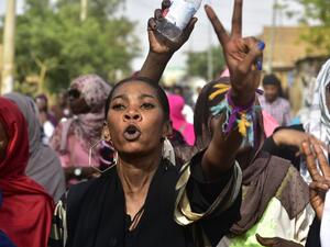 Sudanese protesters take part in a demonstration the Sudanese capital's twin city of Omdurman, to mourn dozens of demonstrators killed last month in a brutal raid on a Khartoum  (AFP)