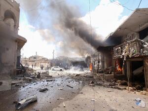 Smoke billows following an airstrike by Syrian regime forces  (AFP)