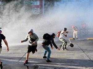 مواجهات في العاصمة التشيلية قبل يومين من استفتاء دستوري