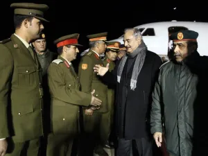 Khalifa Haftar, second from right, the military leader of the so-called Libyan National Army, is greeted after a trip to Russia /AFP