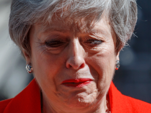 Britain's Prime Minister Theresa May reacts as she announces her resignation outside 10 Downing street in central London on May 24, 2019. Beleaguered British Prime Minister Theresa May announced on Friday that she will resign on June 7, 2019 following a Conservative Party mutiny over her remaining in power.