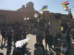 Screenshot from videos of Iraqi protesters storming the US embassy in Iraq on Twitter